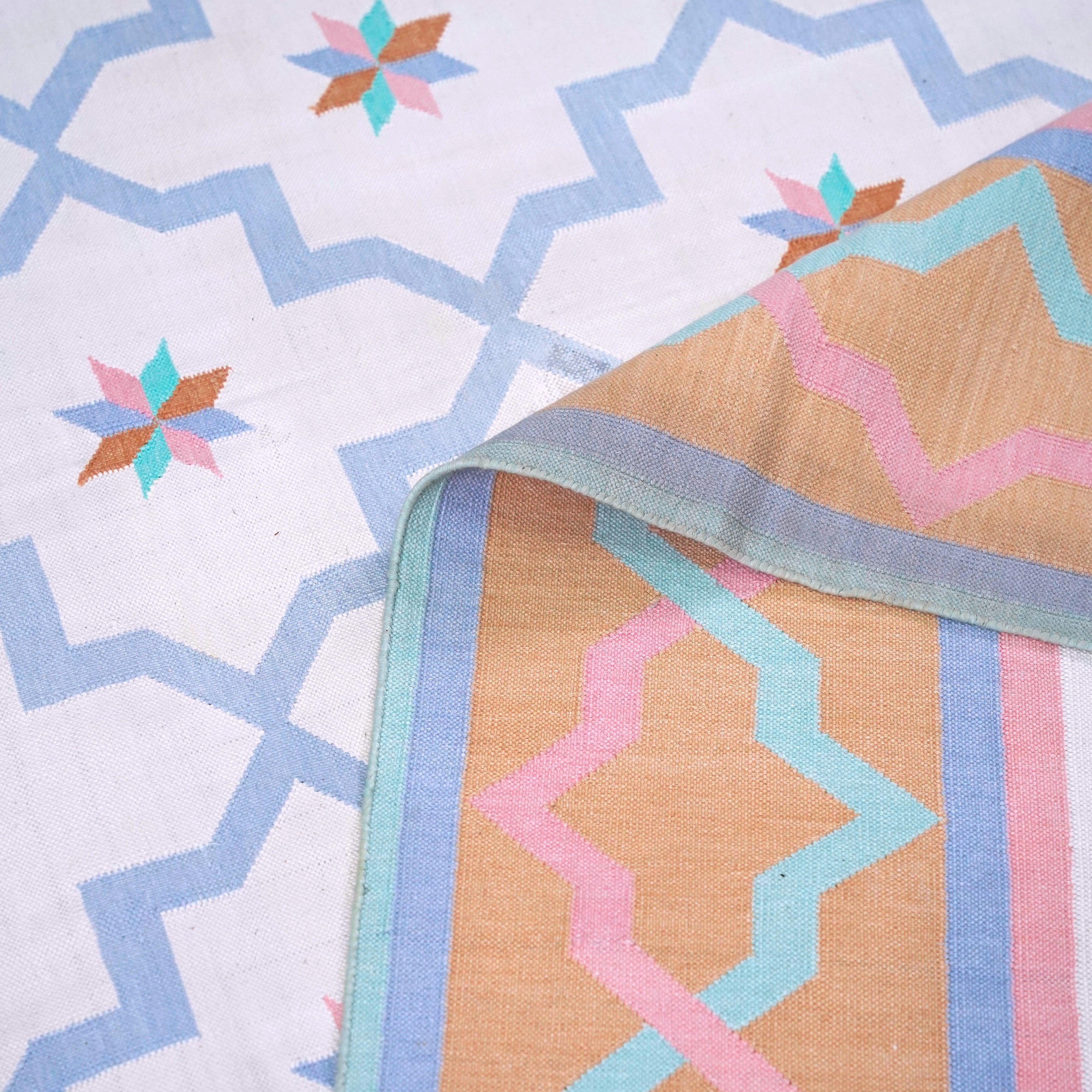Jali Collection- Handwoven cotton Rug for home in Soft Blue and Orange
